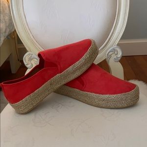 Slip on coral weaved flats